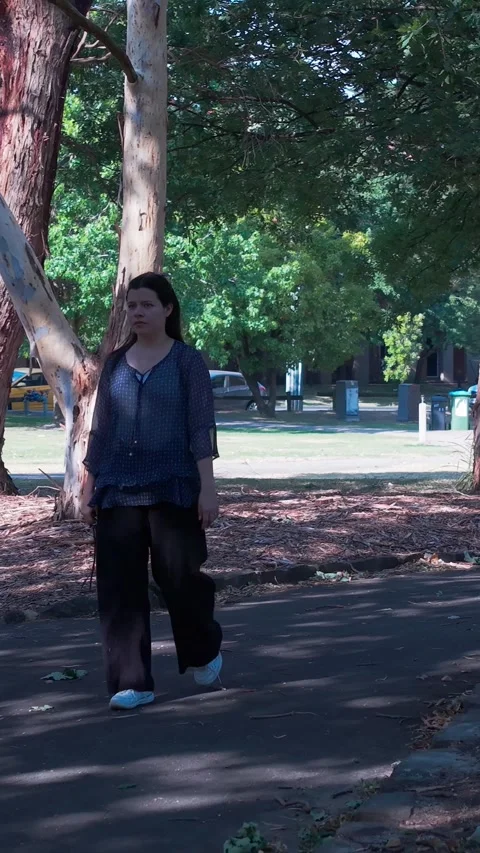 Girl Exploring Croydon Park in Vertical Video Format Stock Footage 327635514