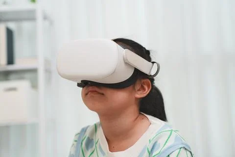 Girl Exploring VR with Headset Learning and Play Stock Photos