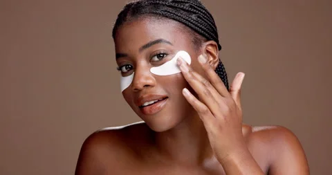 Girl, eye patch and face with beauty in studio for dark circles, cosmetics or Stock Footage 312751989