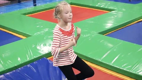 The girl is falling on her back on the mat Stock Footage 86387799