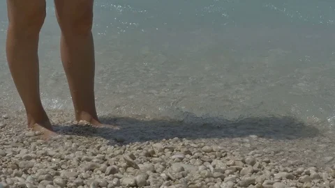Girl Feet Splashed by Waves Stock Footage 77355329