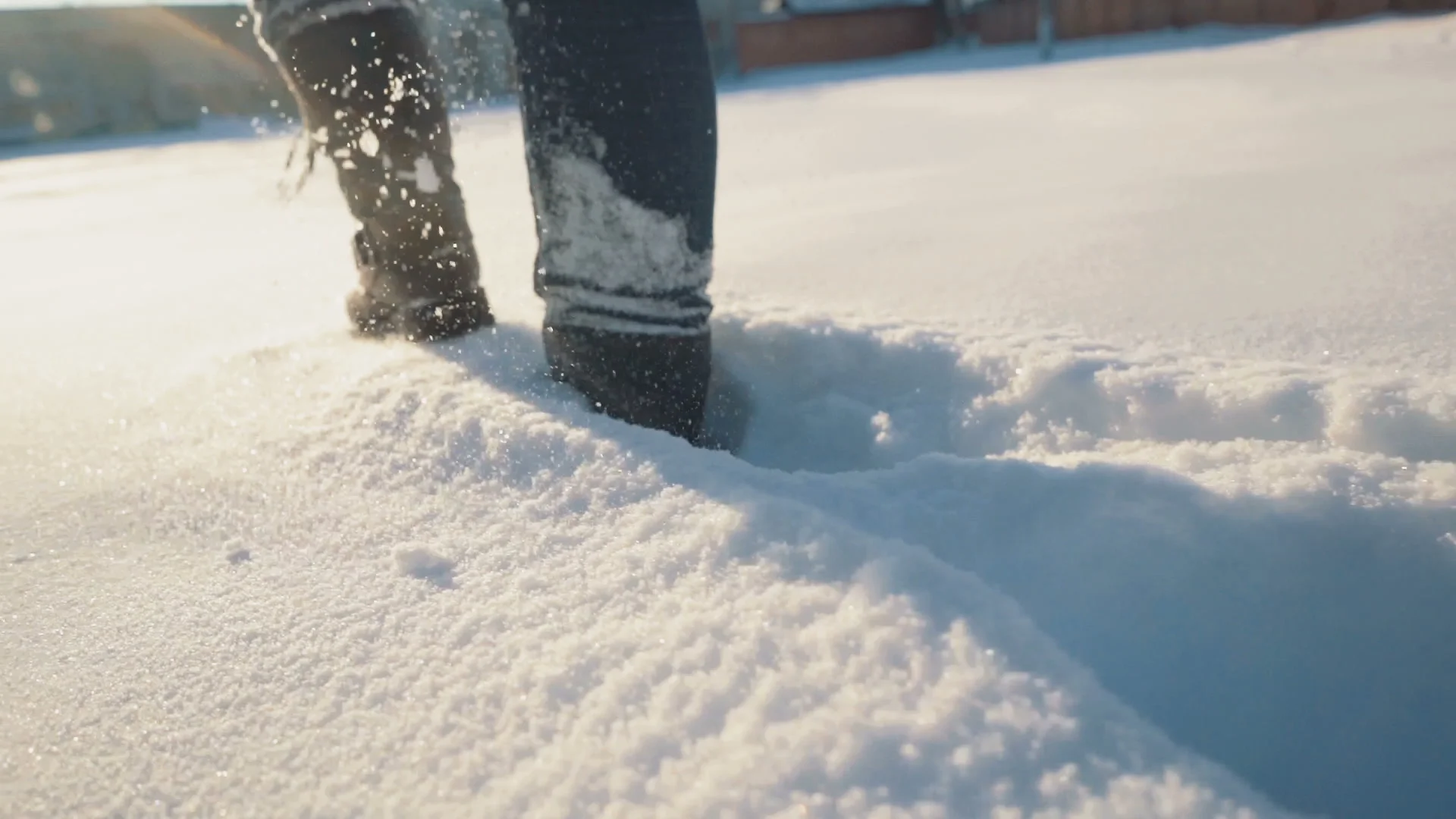 Female feet in boots and leggings, winter walking in snow Stock