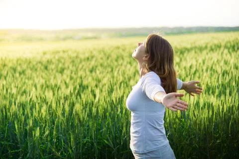Girl in field at summer Stock Photos