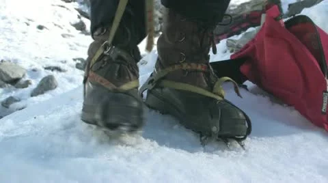 Girl fitting crampons Stock Footage 18155190