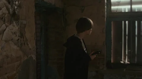 Girl with Flashlight Exploring Place when Clown Attacking Her from behind Stock Footage 250953216