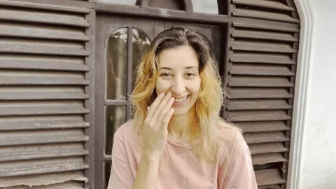 Girl flirting with camera man Stock Footage 232397853