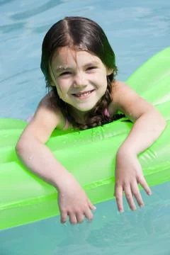 Girl on floatation device Foto stock