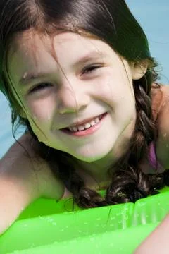 Girl on floatation device Foto stock
