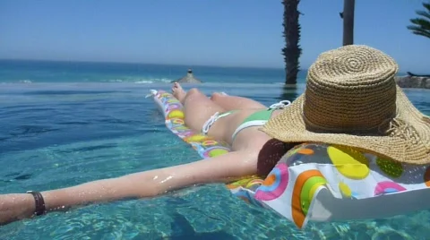 Girl Floating in Pool 1 Stock Footage 736213
