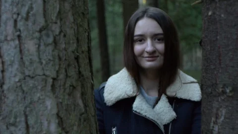 Girl in the forest, between two trees, high bitrate Stock Footage 123147831