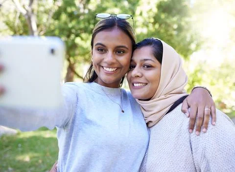 Girl, friends and islam for selfie in park with smile, hug and happy for summer Stock Photos