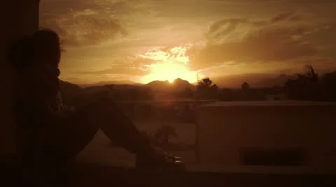 Girl in front os sunset Stock Footage 10908693