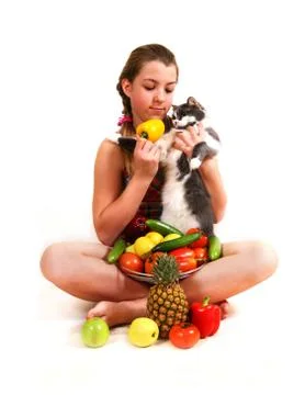 Girl with fruit and a cat Stock Photos
