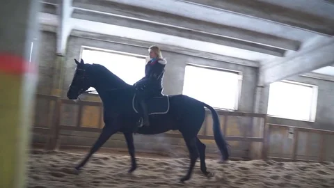 Girl galloping on a black horse Stock-Footage 72270153