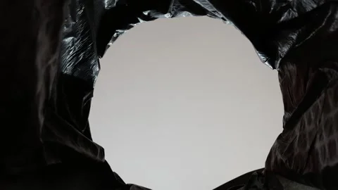 The girl at the garbage can is sorting waste throwing Stock Footage 306090556