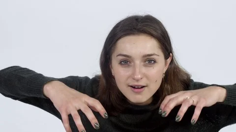 Girl gestures with hands on camera Stock Footage 81811201