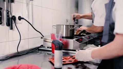 Girl gets chocolate hemisphere with rubber molds. Stock Footage
