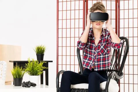 Girl getting experience using VR-headset glasses of virtual reality Stock Photos