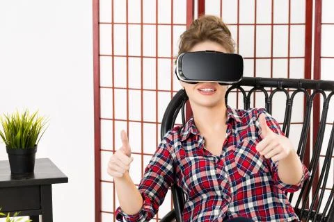 Girl getting experience using VR-headset glasses of virtual reality 스톡 사진