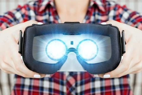 Girl getting experience using VR glasses of virtual reality 写真素材