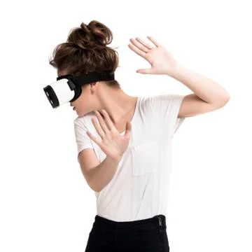 Girl getting experience using VR glasses of virtual reality Stock Photos