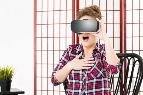 Girl getting experience using VR glasses of virtual reality Foto stock