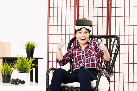 Girl getting experience using VR glasses of virtual reality Stock-Fotos