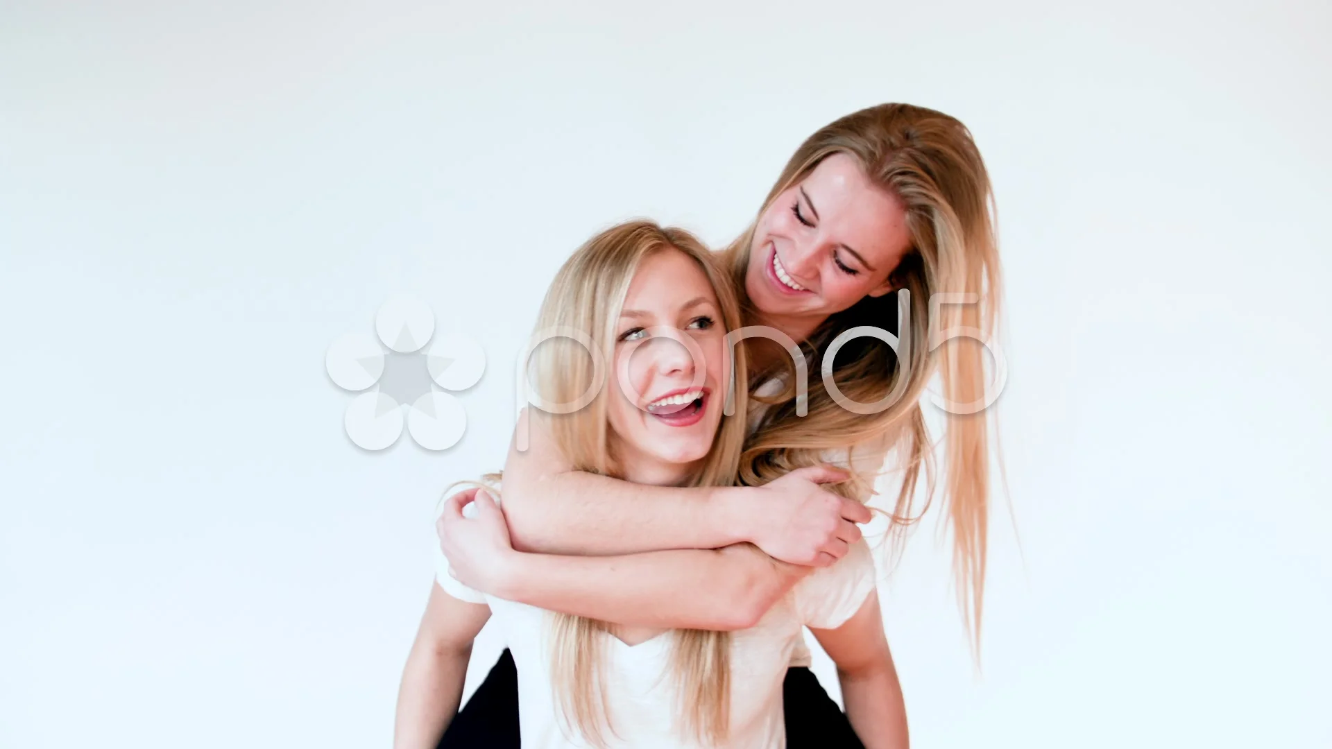 Black girl giving friend a piggyback ride Stock Photo - Alamy