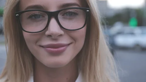 The girl in glasses posing on camera. slow motion Video stock 161348831