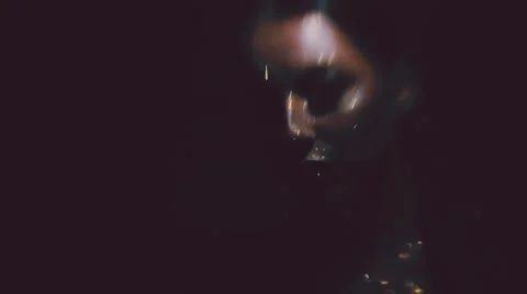 Girl with glitter on her face glows in the dark Stock Footage