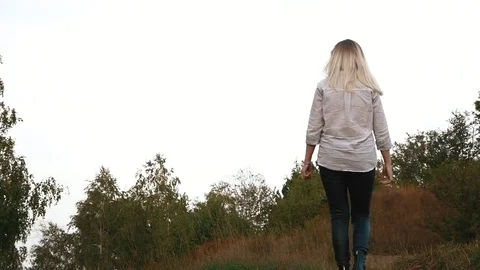 The girl goes along the path Stock Footage 80436044