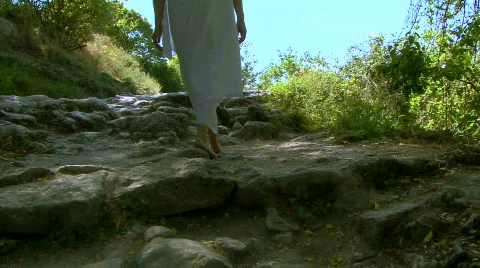  girl goes on ancient road Stock Footage