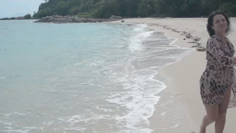 Girl goes on an empty Beach Stock Footage 86490622