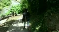 Girl going steps downward to a tropic waterfall - Bali part 1/2 HD Footage