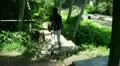Girl going steps downward to a waterfall - Bali part 2/2 HD Footage