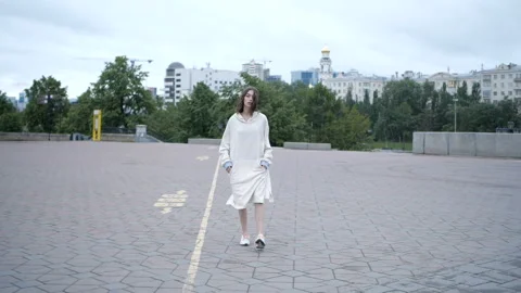 Girl is going through the square Stock Footage 91893474