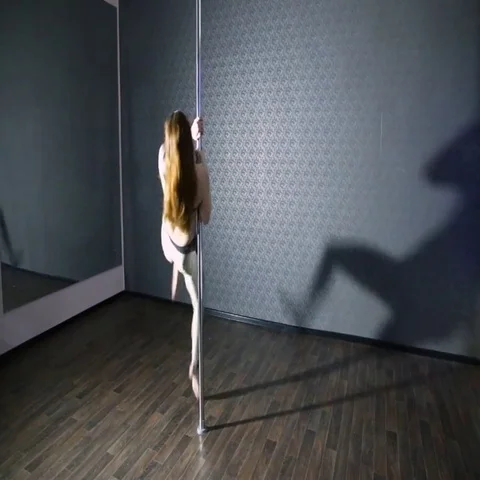 Girl in gold dancing pole dance Stock Footage 69501029