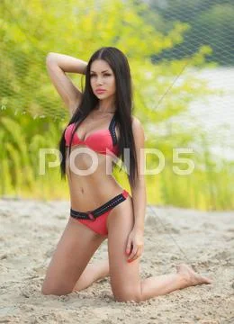 Girl in good shape with long dark hair Stock Photos