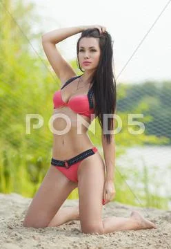 Girl in good shape with long dark hair Stock Photos