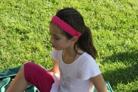 Girl On Grass Stock Photos