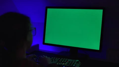 Girl of Green Screen Display PC at Desk in Home at Night. Desktop PC Monito.. Stock Footage 346086097