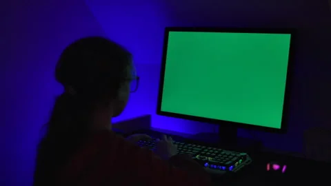 Girl of Green Screen Display PC at Desk in Home at Night. Desktop PC Monito.. Stock Footage 346086149