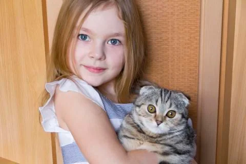 Girl with grey kitty Stock Photos