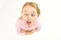 The girl grimace to the camera. View from above Photo