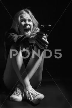 Girl with gun Stock Photos