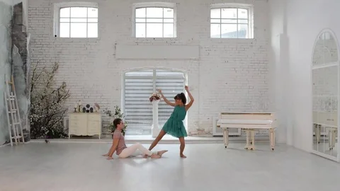Girl with guy dance gymnastic dance in the dance hall Stock Footage