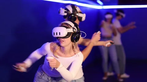 Girl with guy pair wearing virtual reality glasses participate in game with Stock Footage 341384089