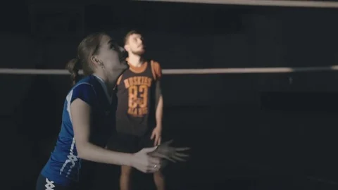 Girl with a guy playing volleyball Stock Footage