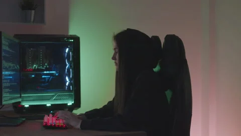 Girl hacker typing at the computer Stock Footage 197420066