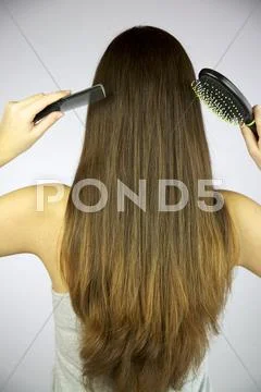 Girl with hairbrush and comb Stock Photos